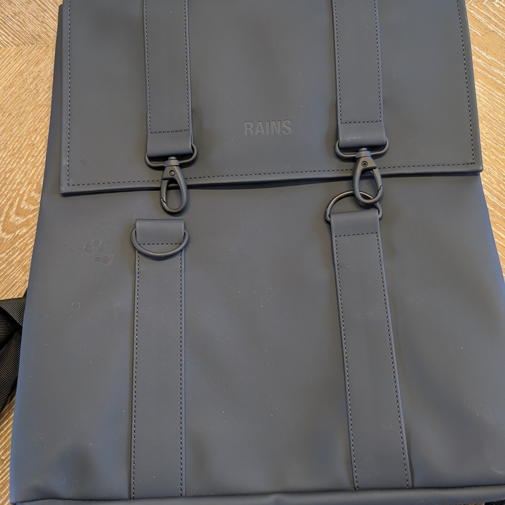 Rains Blue Backpack with Minimalist Design and Waterproof Material